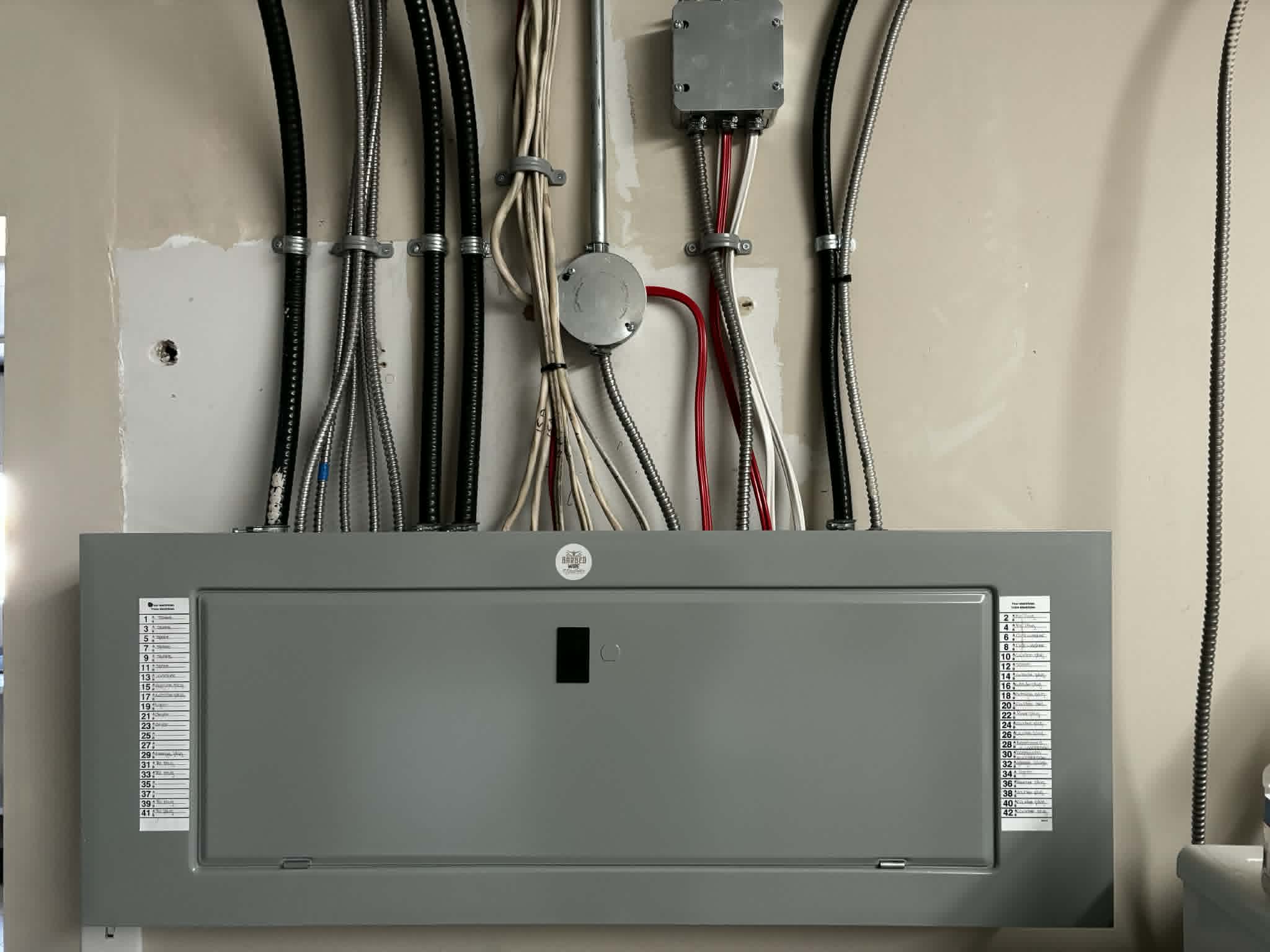Electrical panel and conduit wiring prior to finishing