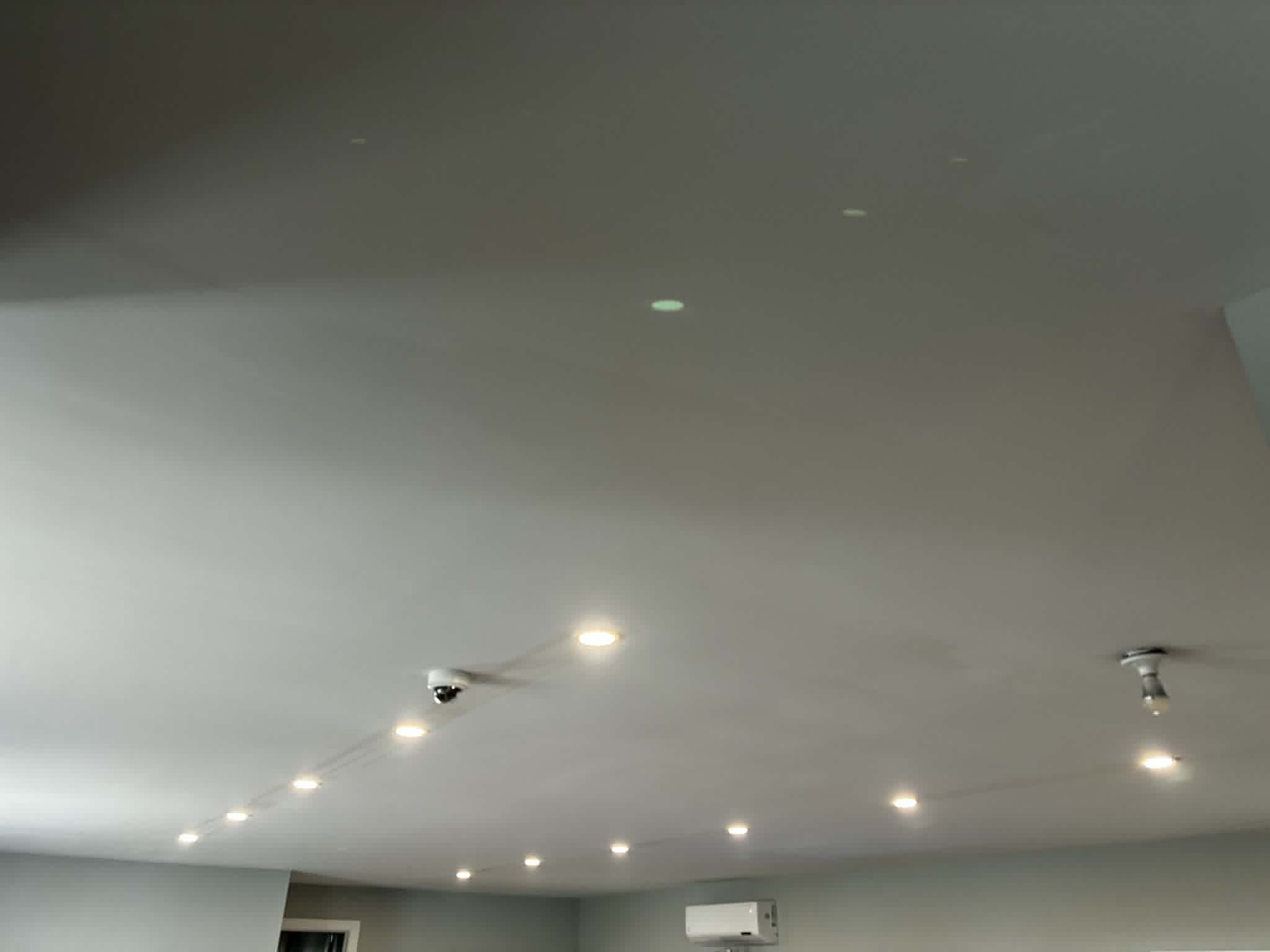 Recessed ceiling lights installed in a finished room