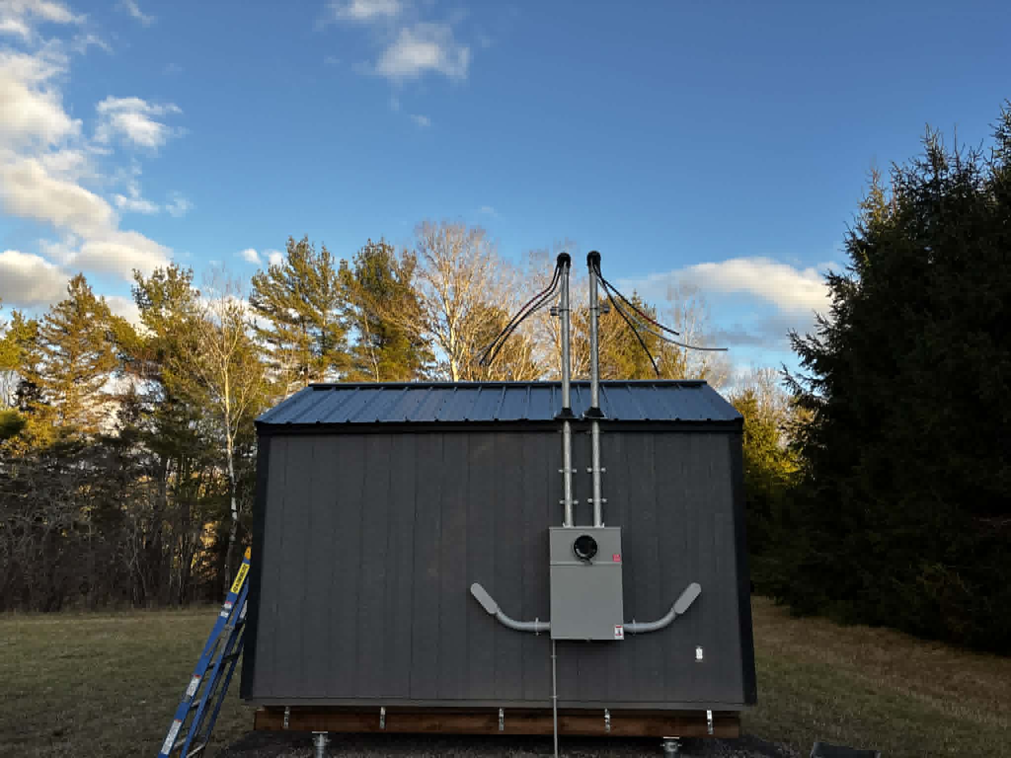 Exterior electrical service installation on an outbuilding